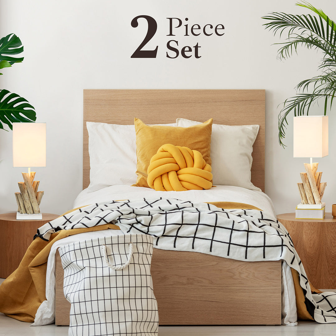 Two-piece Jelena-Reclamed-Wood-Modern-Lamp-MuellerHome-RW-1700-light with yellow knot pillow and checkered blanket on a bed with wooden headboard.