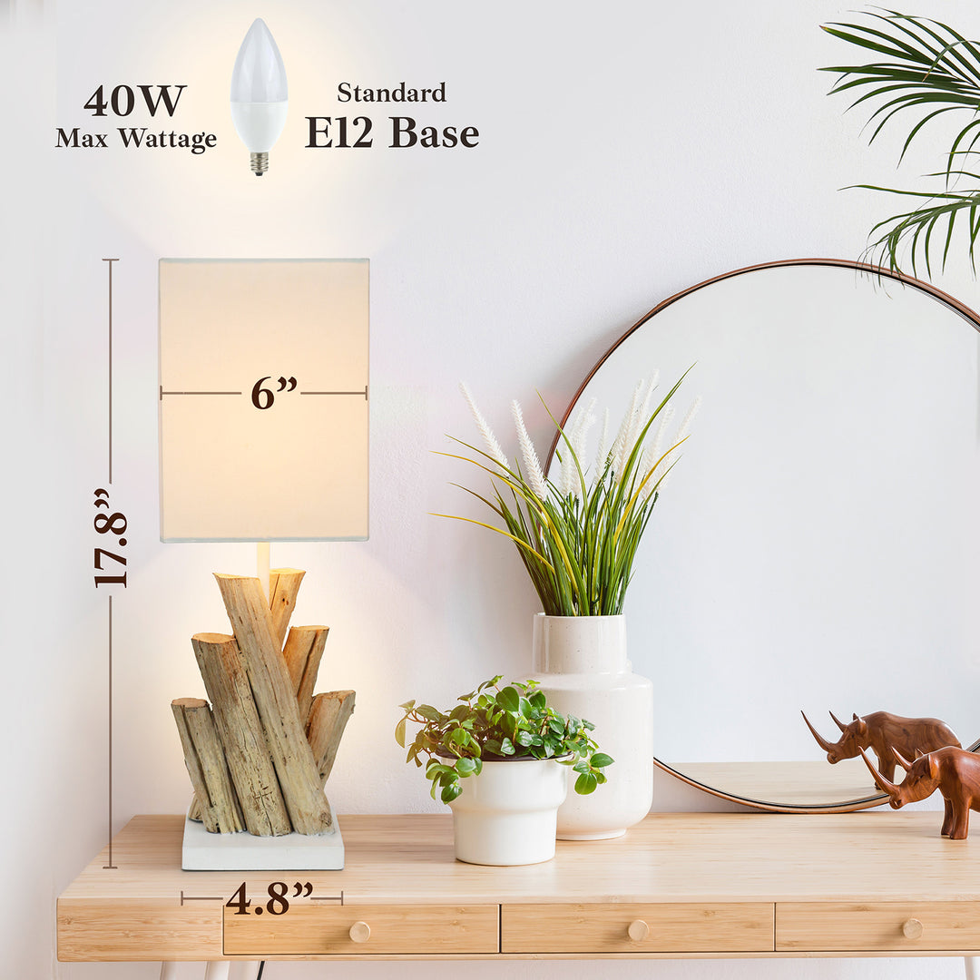 Table lamp with measurements on a wooden surface with decorative items.