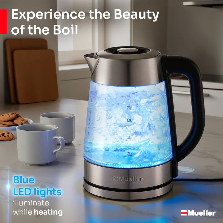Mueller-Glass-electric-kettle-tea with blue LED lights on a kitchen counter, featuring Mueller branding.