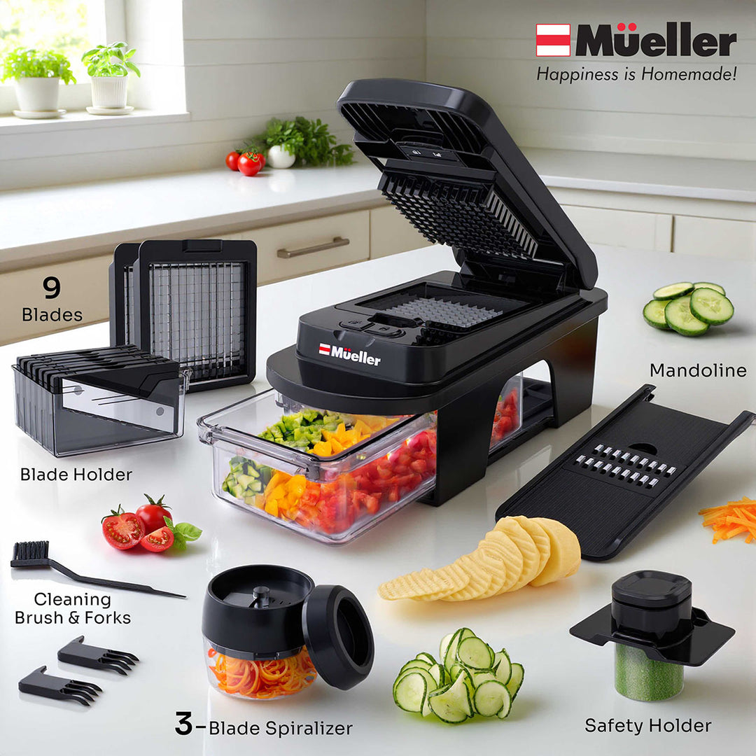 Mueller_12_Blade_Vegetable_Chopper_all black accessories  with various attachments on a kitchen counter.