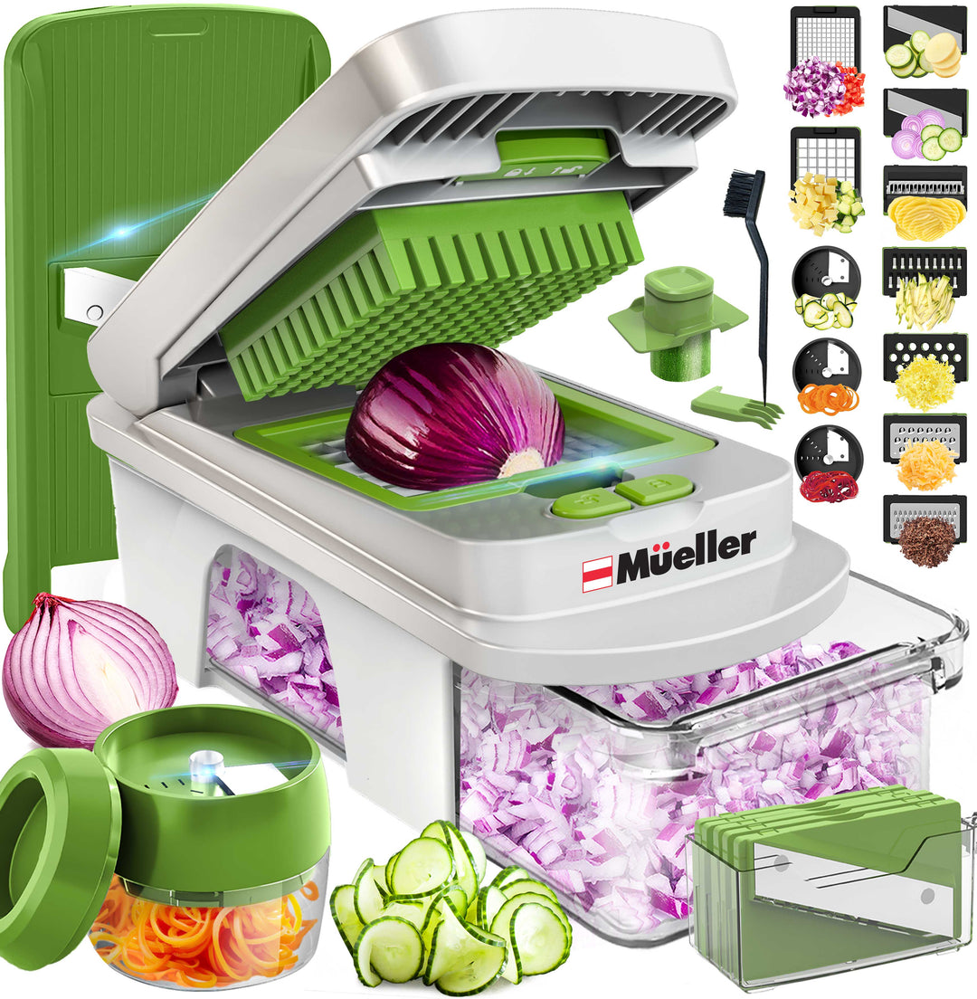 Mueller_12_Blade_Vegetable_Chopper_white/green with various attachments and sliced vegetables displayed around it, featuring the brand 'Mueller'.