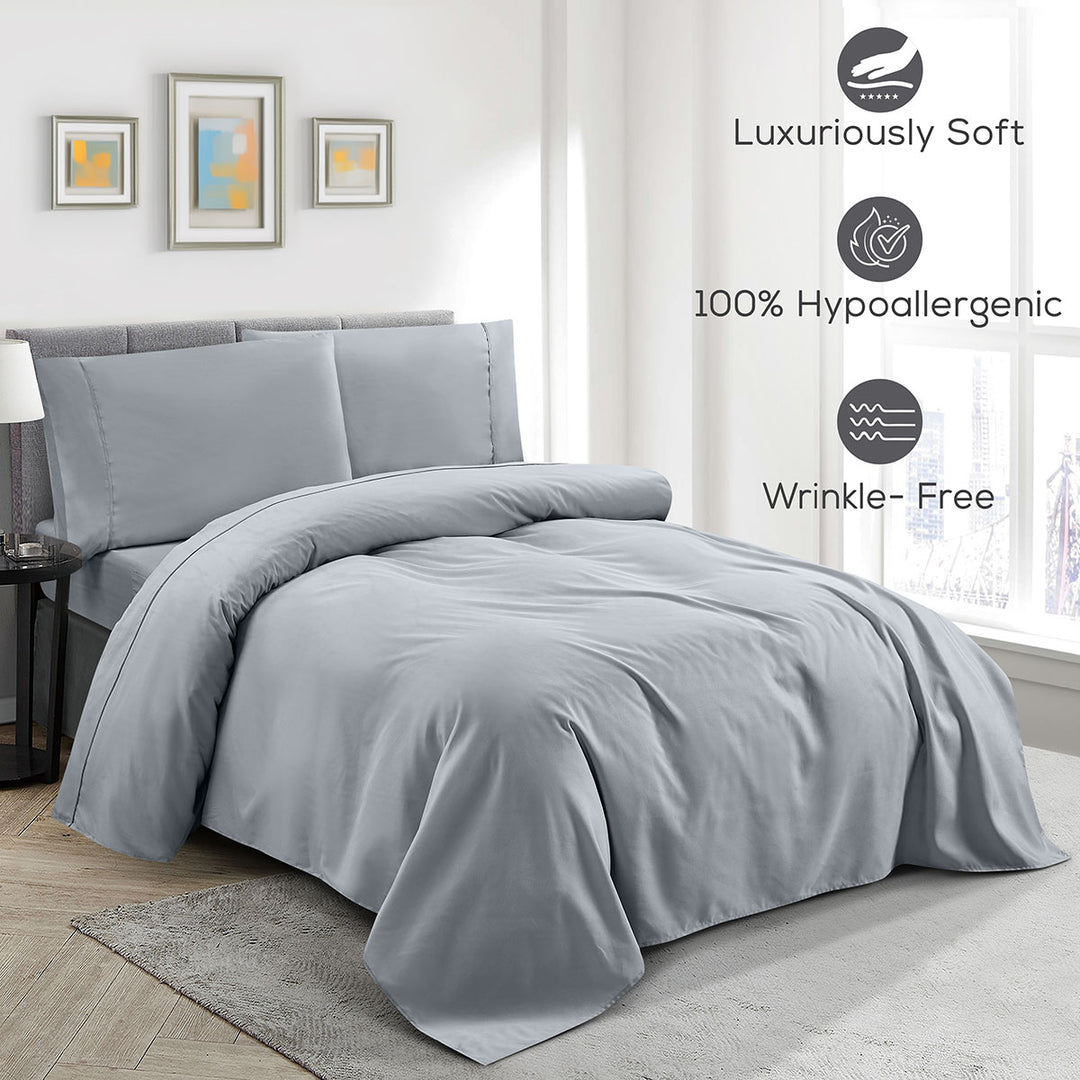 Gray bedding set on a bed in a bedroom with features highlighted.