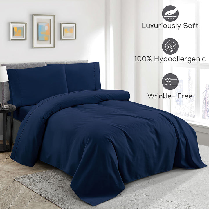 Navy blue bedding set on a bed in a bedroom with 'Luxuriously Soft', '100% Hypoallergenic', and 'Wrinkle-Free' features displayed.