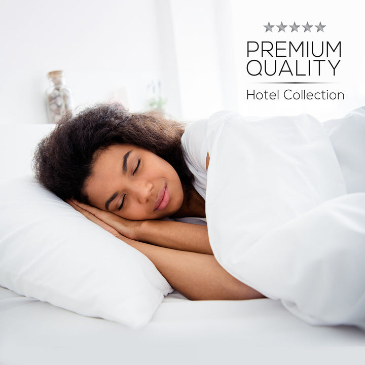 Woman sleeping soundly under white bedding with 'Premium Quality Hotel Collection' text.