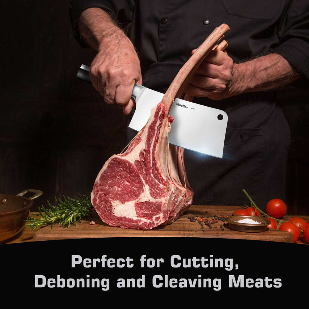 Person cutting a large piece of meat with a Mueller Cleaver Knife stainless steel on a wooden cutting board.