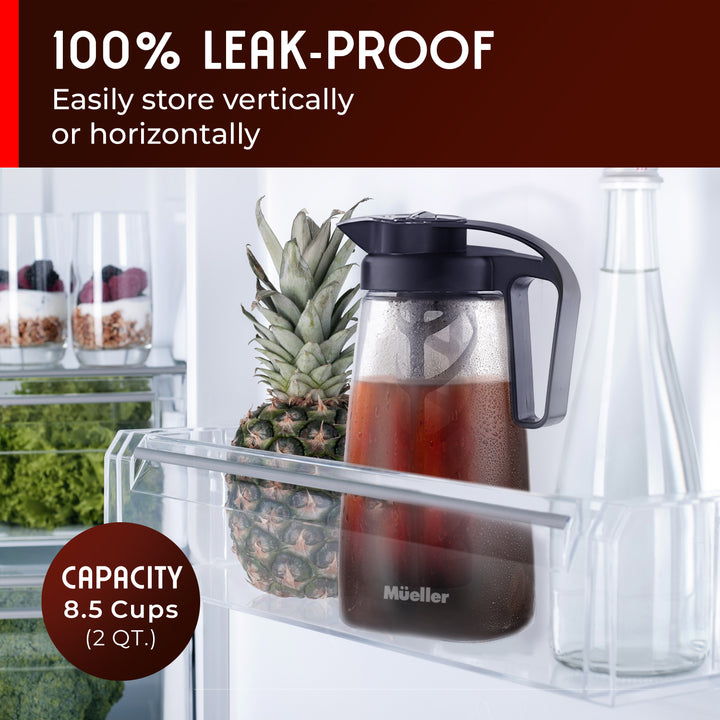 Glass container with black lid on a shelf next to a pineapple, with text highlighting leak-proof feature and capacity.