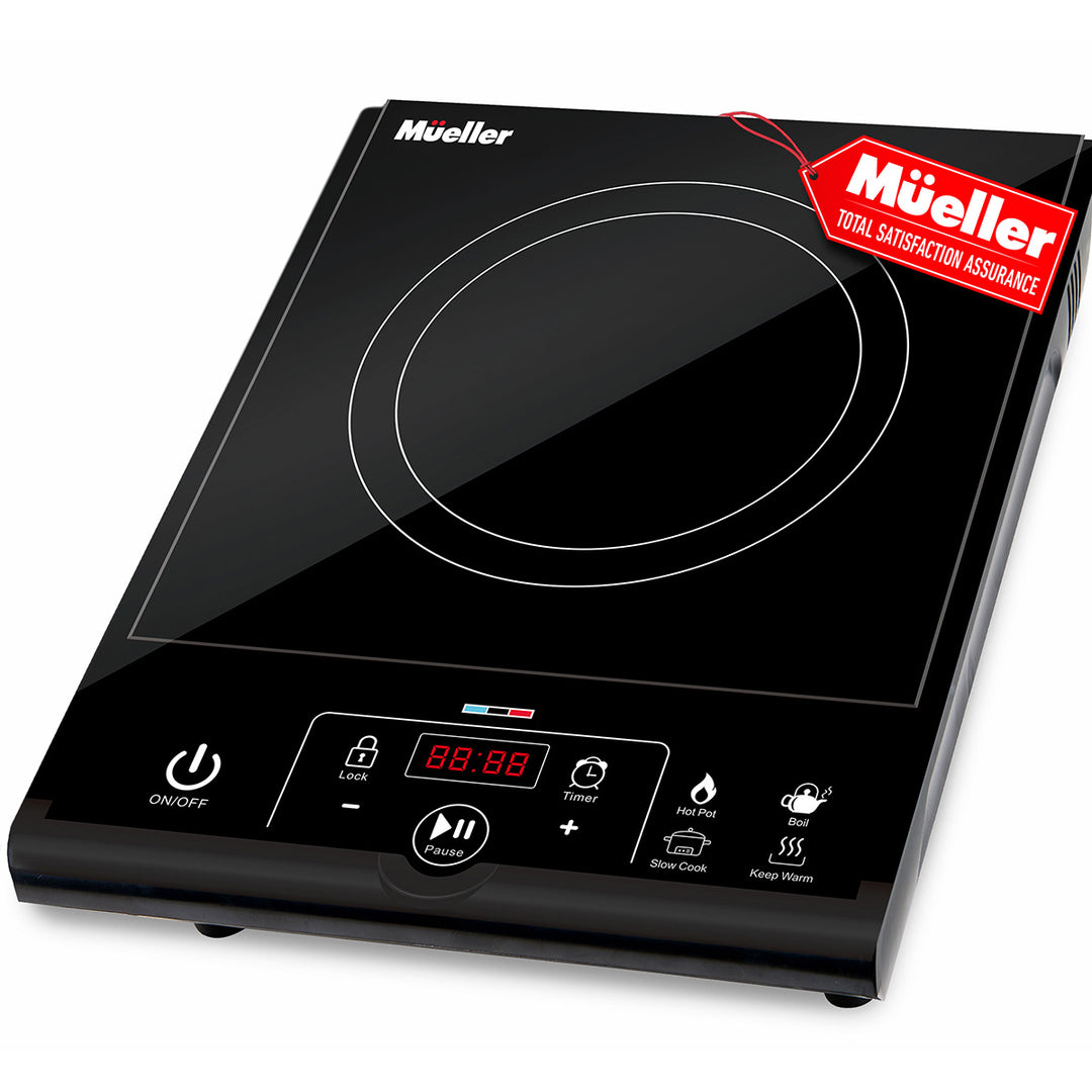 Black Mueller induction cooktop with digital display on a white background