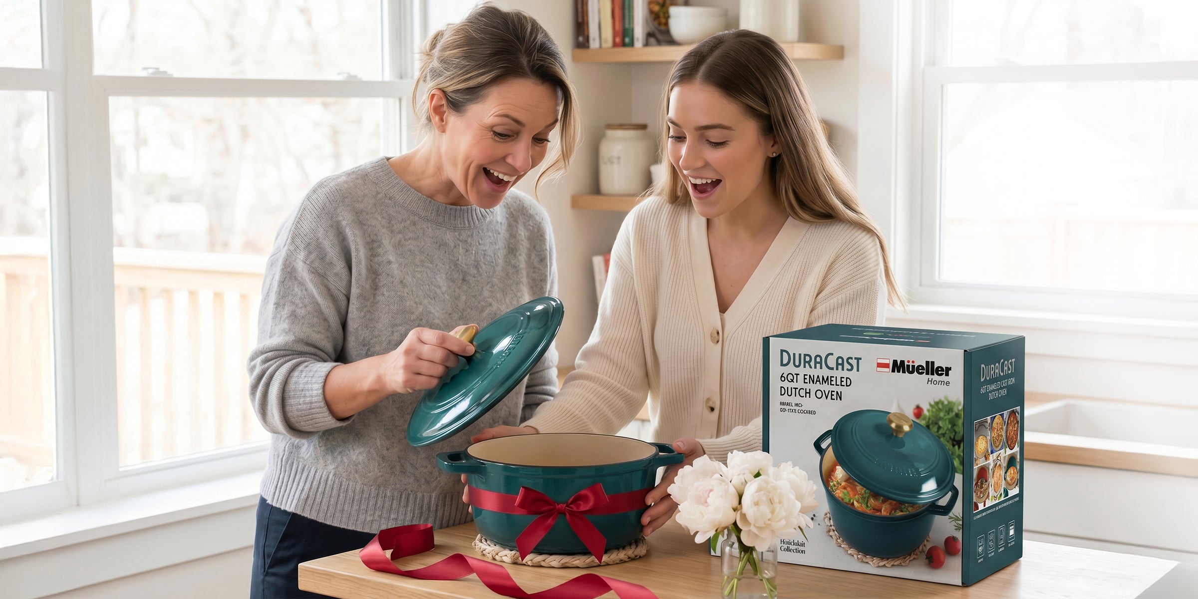 Two women opening a box of Mueller Dutch oven emerald 6 QT  set in a bright kitchen.