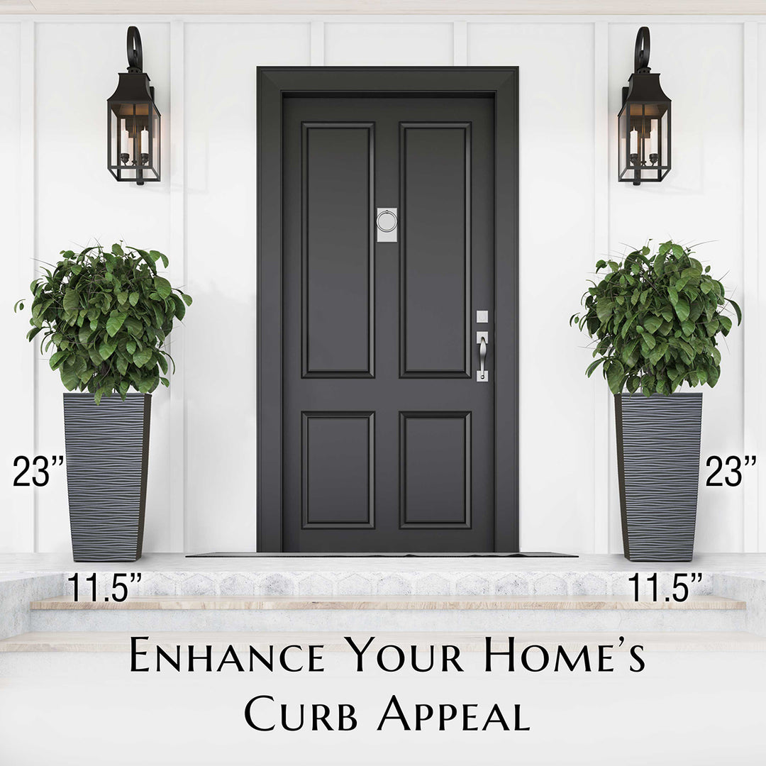 Black front door with planters on either side on a white wall background. Showing the size of the planters.