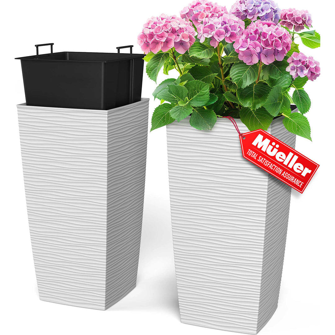 White striped planters with pink flowers and a red 'Muller' tag on a white background