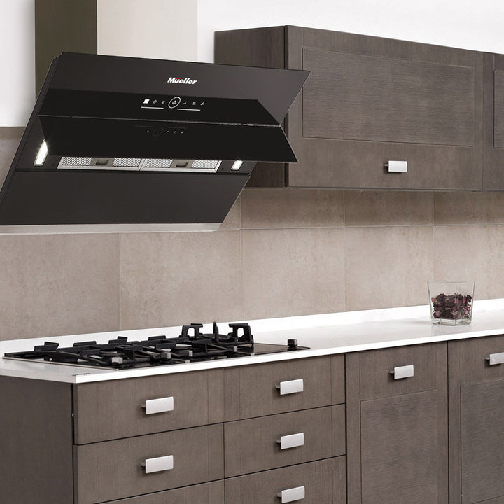 Modern kitchen with black range hood and gas stove