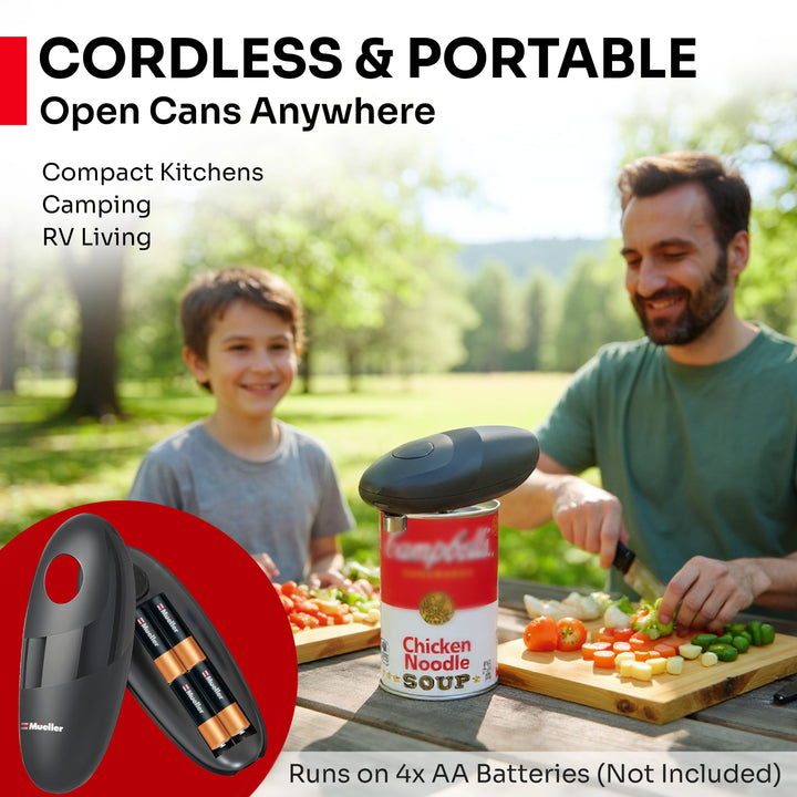 Man and child preparing food outdoors with a portable can opener and  Chicken Noodle Soup can.