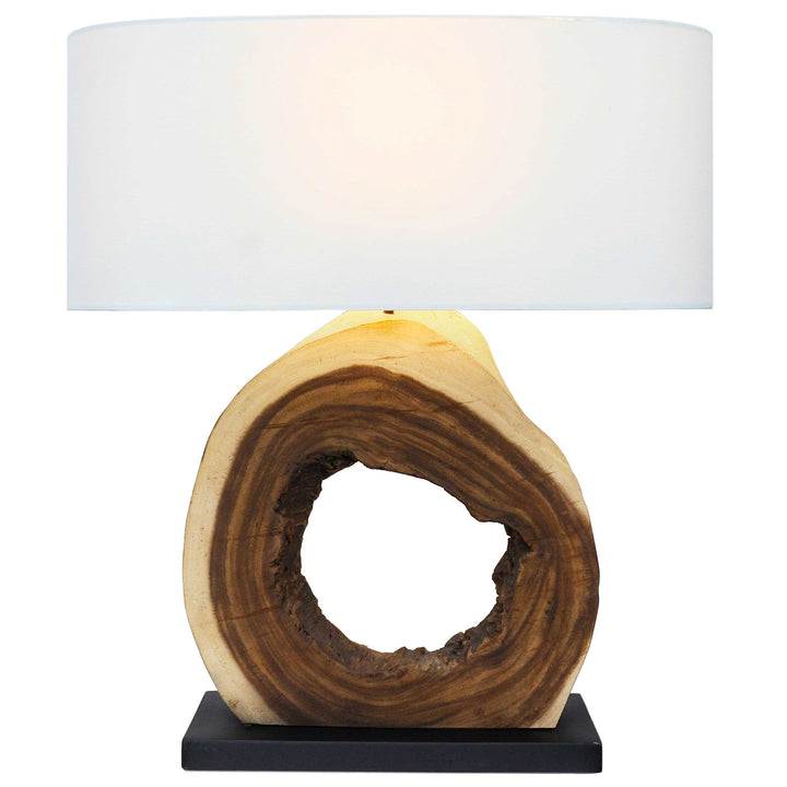 Table lamp with wooden base and white shade on a white background